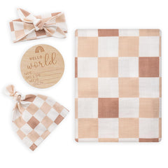 BabyWhale swaddle blanket checkered fabric close-up highlighting ultra-soft bamboo-cotton blend for delicate skin.