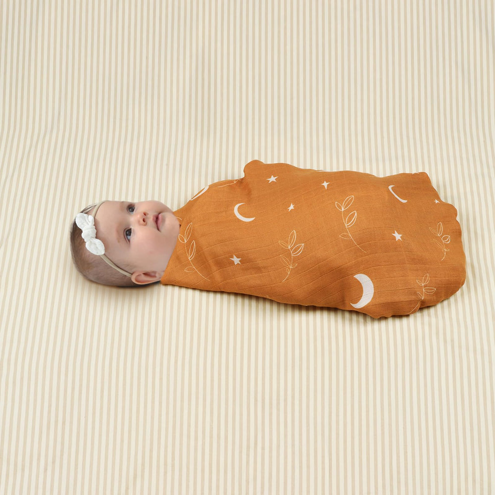 BabyWhale swaddle being wrapped securely to demonstrate snug wrap and versatility