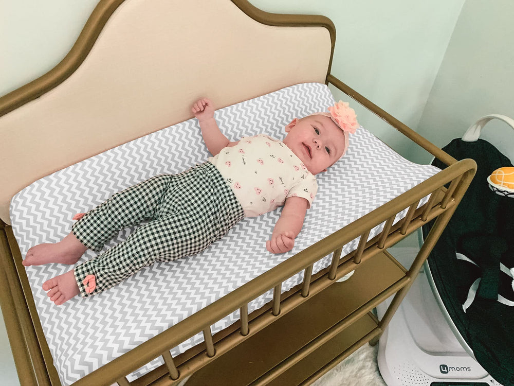 BaeBae Goods grey white nursery design complements modern nurseries.