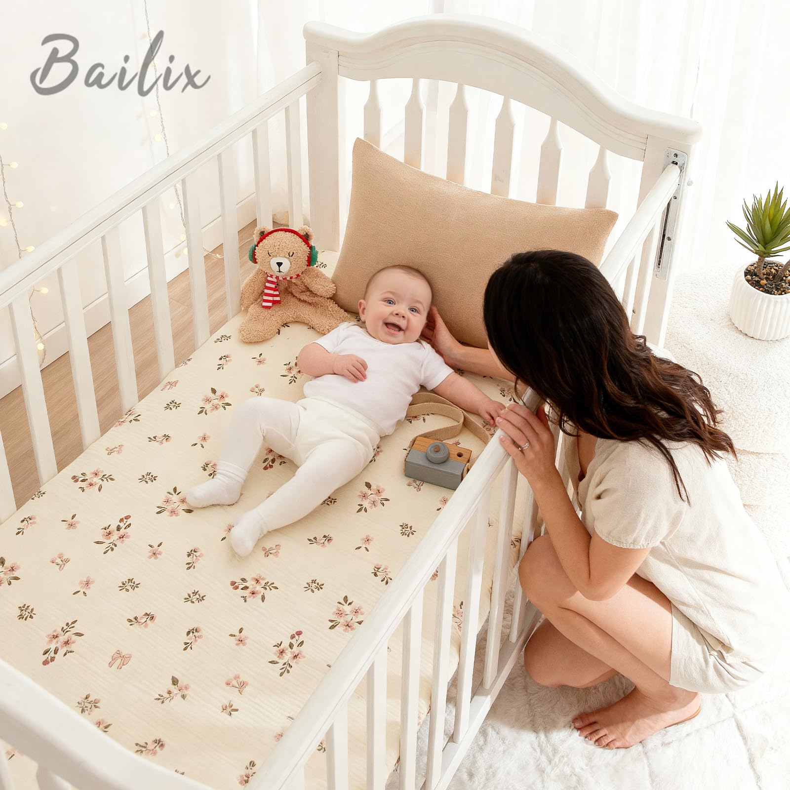 Bailix crib sheet on mattress showing secure 360° elastic fit