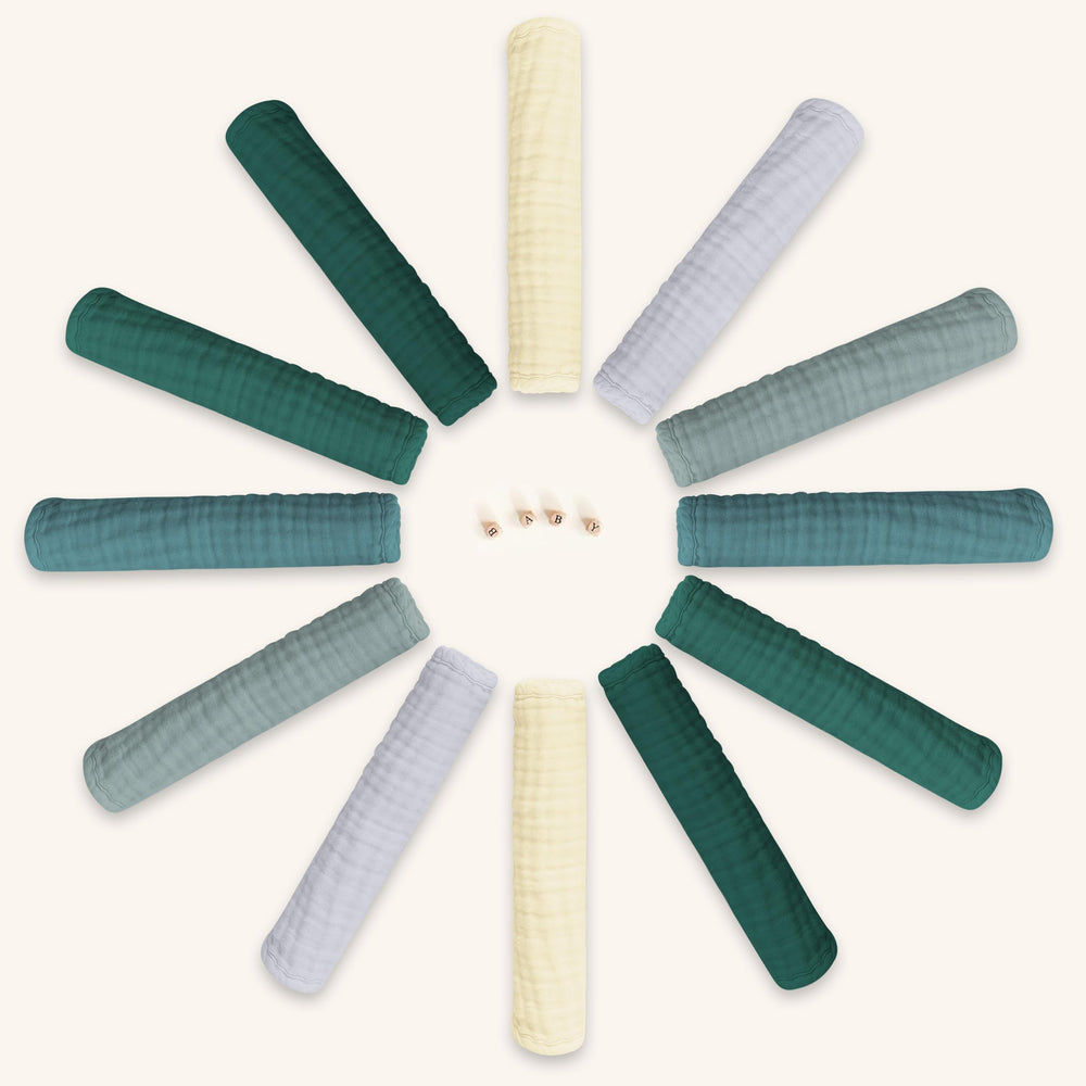 BAMBOO QUEEN slate burp cloths spread highlighting gentle, durable muslin for spill protection.