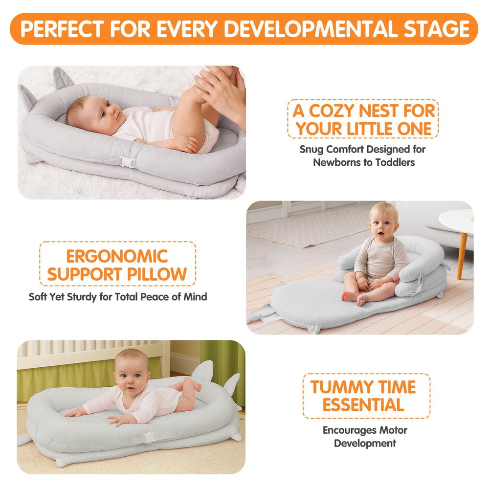 Banakshol baby lounger gray in use on a soft surface for resting.