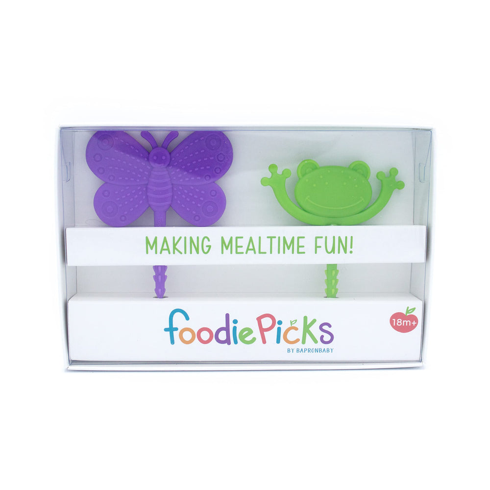 Child using BapronBaby Foodie Picks to practice independent feeding
