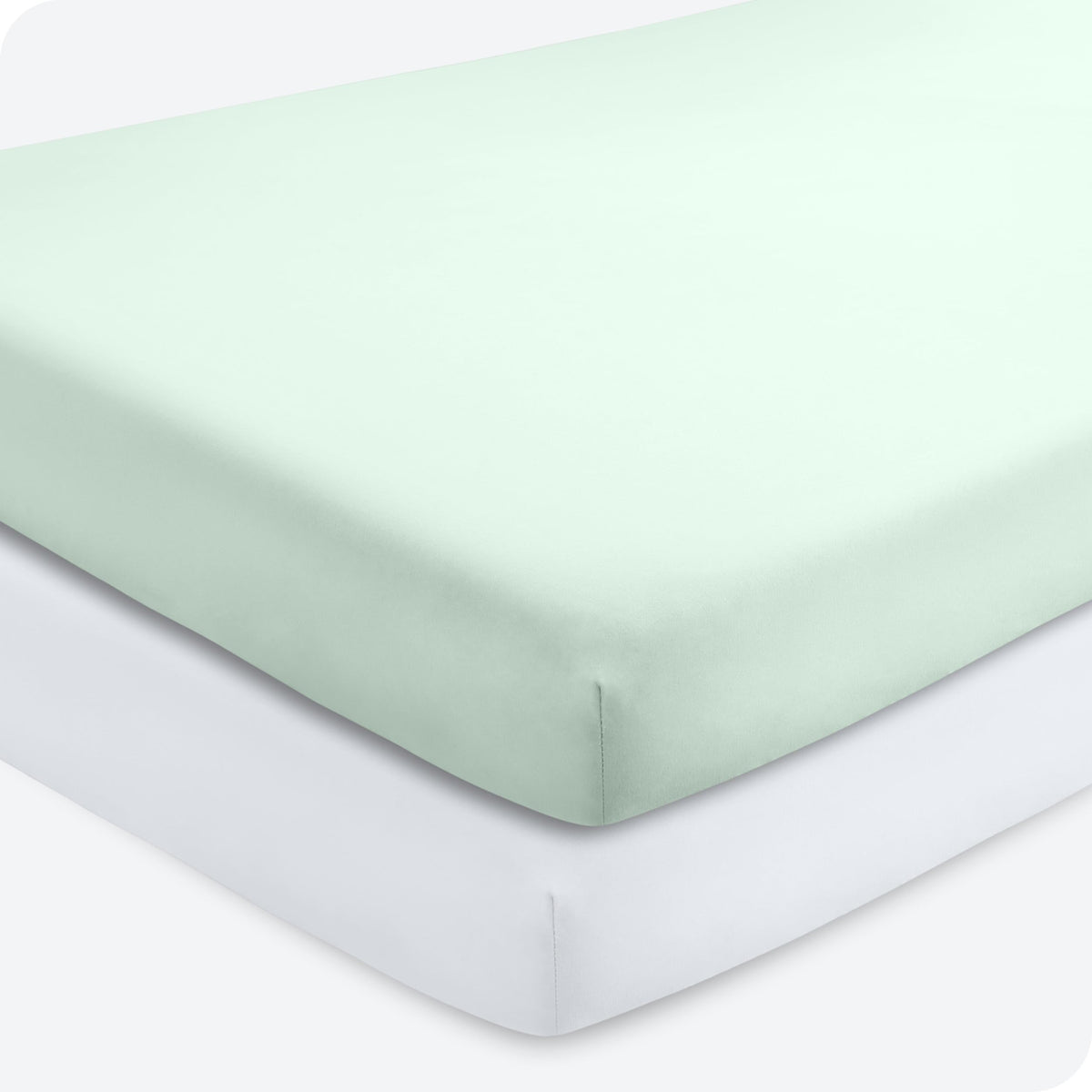 Bare Home 2-pack crib sheets in spring mint and white folded for easy storage and soft sleep.
