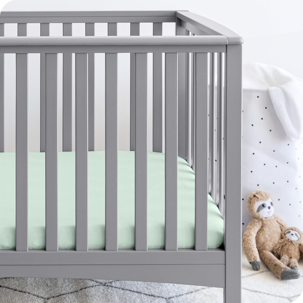 Bare Home 3-pack crib sheets folded together for easy nursery organization.