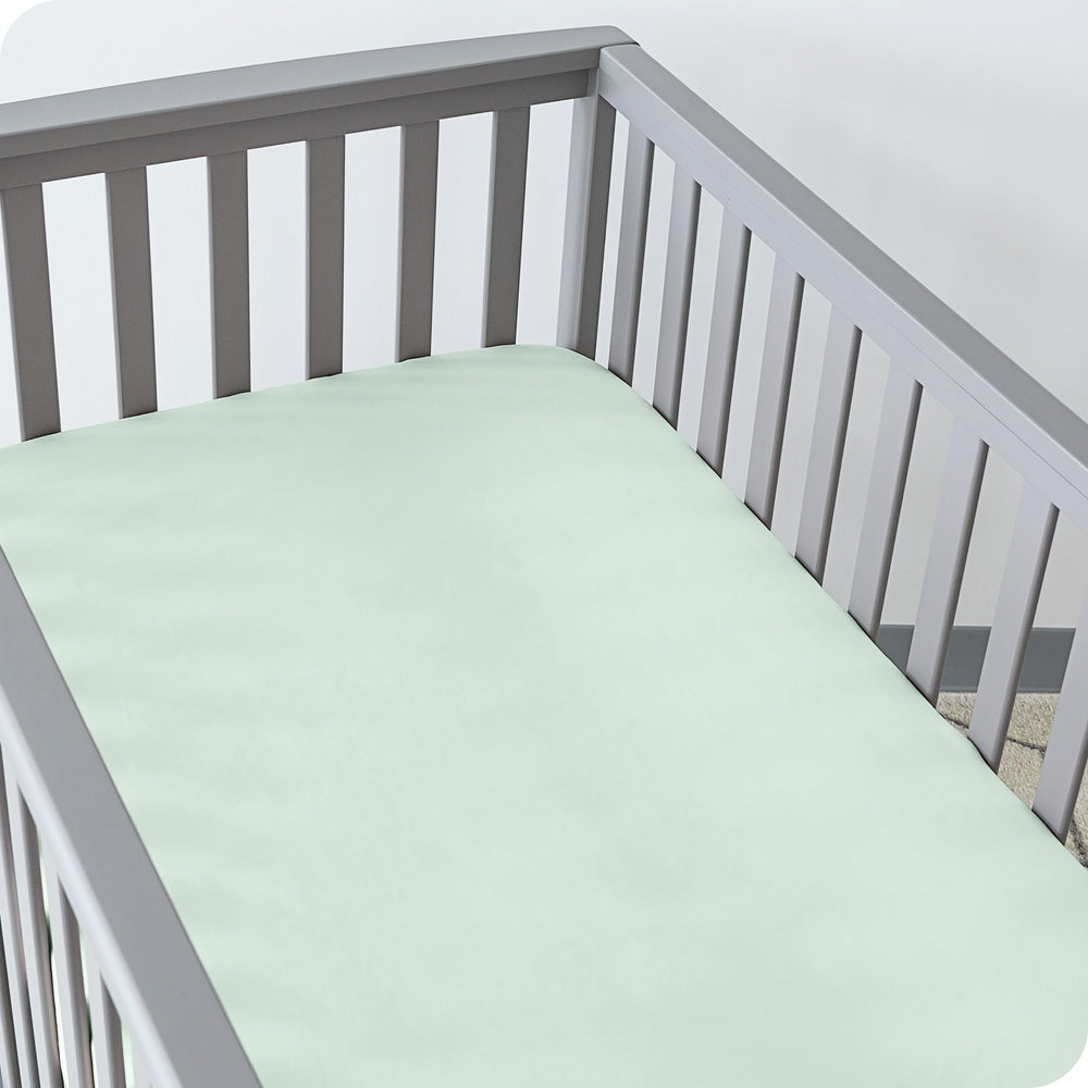 Bare Home fitted crib sheet elastic edge ensures secure fit.