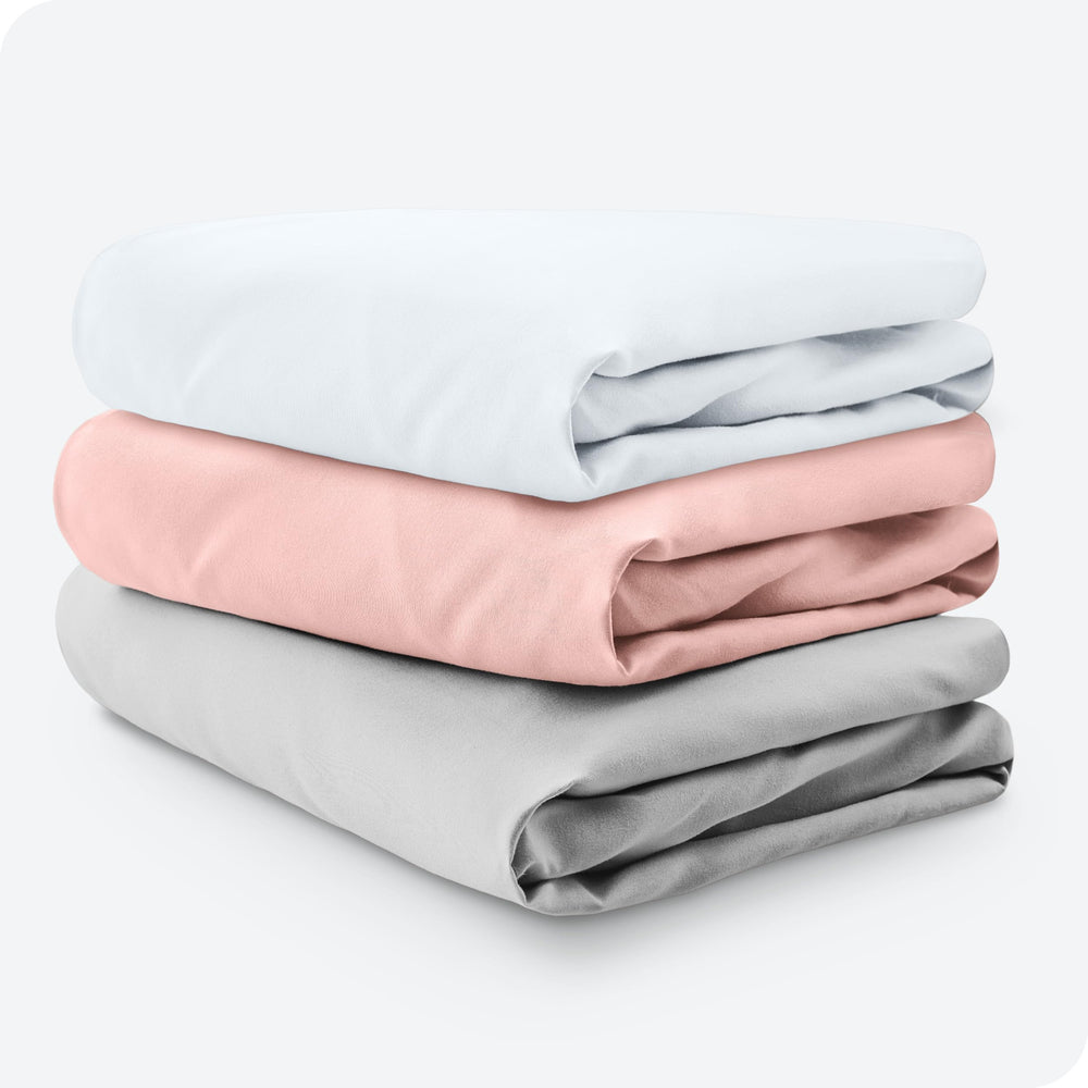 Bare Home fitted crib sheet demonstrates secure elastic fit on mattress edge.