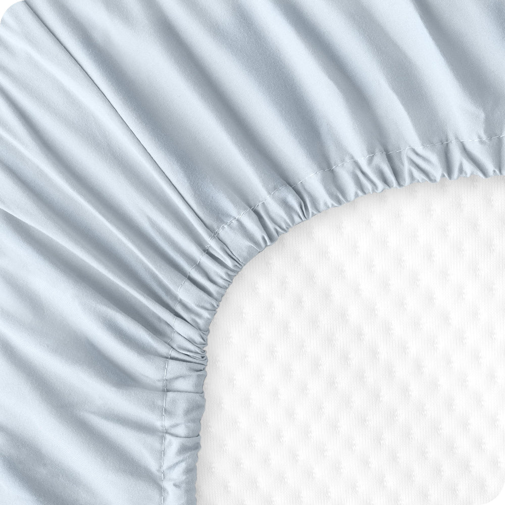 Bare Home machine-washable crib sheets for easy care.