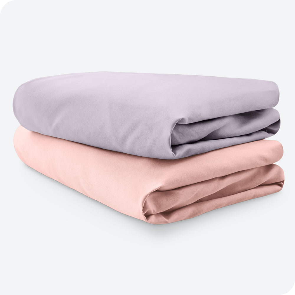 Bare Home nap-time scene with pink slipper and lilac sheets