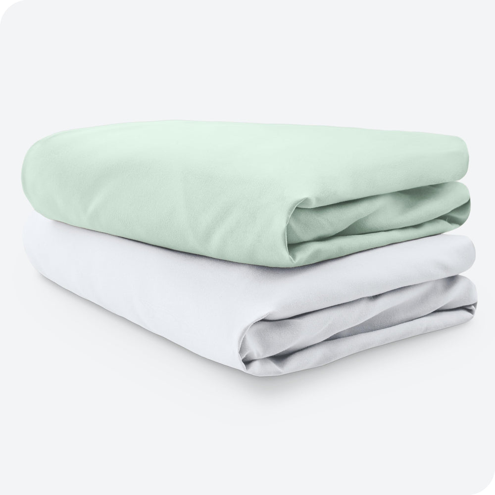 Bare Home crib sheets in mint and white brighten the nursery palette.