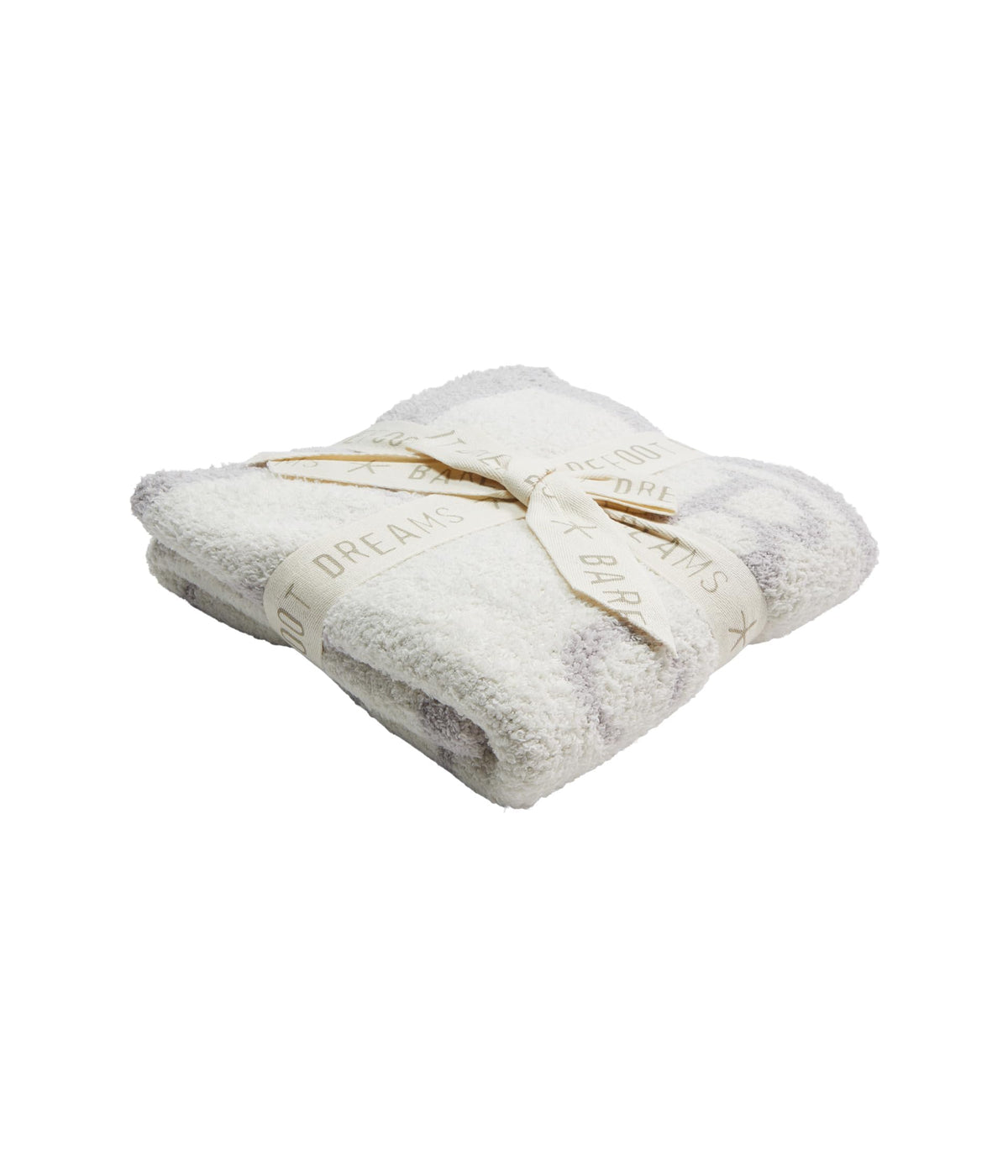 Barefoot Dreams CozyChic ABC Blanket in Oyster/Cream folded on couch for cozy study.