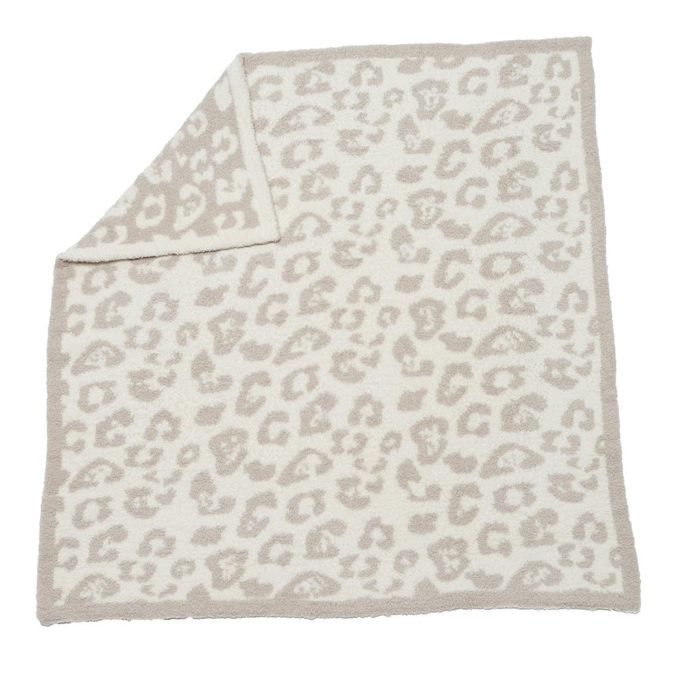 Barefoot Dreams CozyChic baby blanket with wild print; plush warmth for snuggly moments.