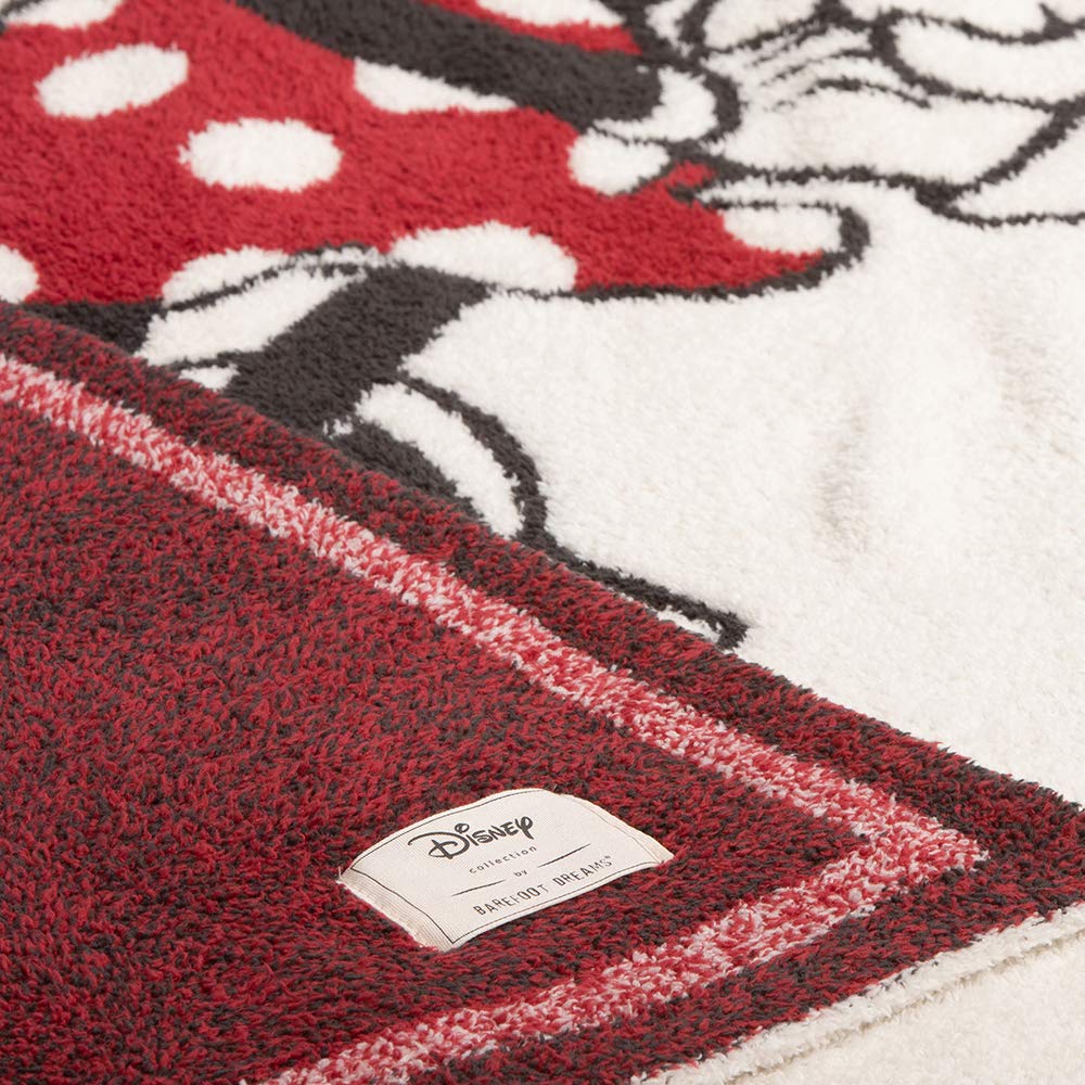 Barefoot Dreams CozyChic Disney blanket stroller-nap demonstrates easy layering during travel.