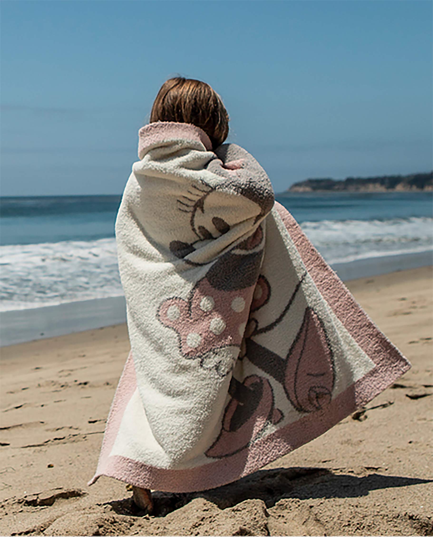 Barefoot Dreams CozyChic feather-yarn texture emphasizes luxurious softness for swaddling.