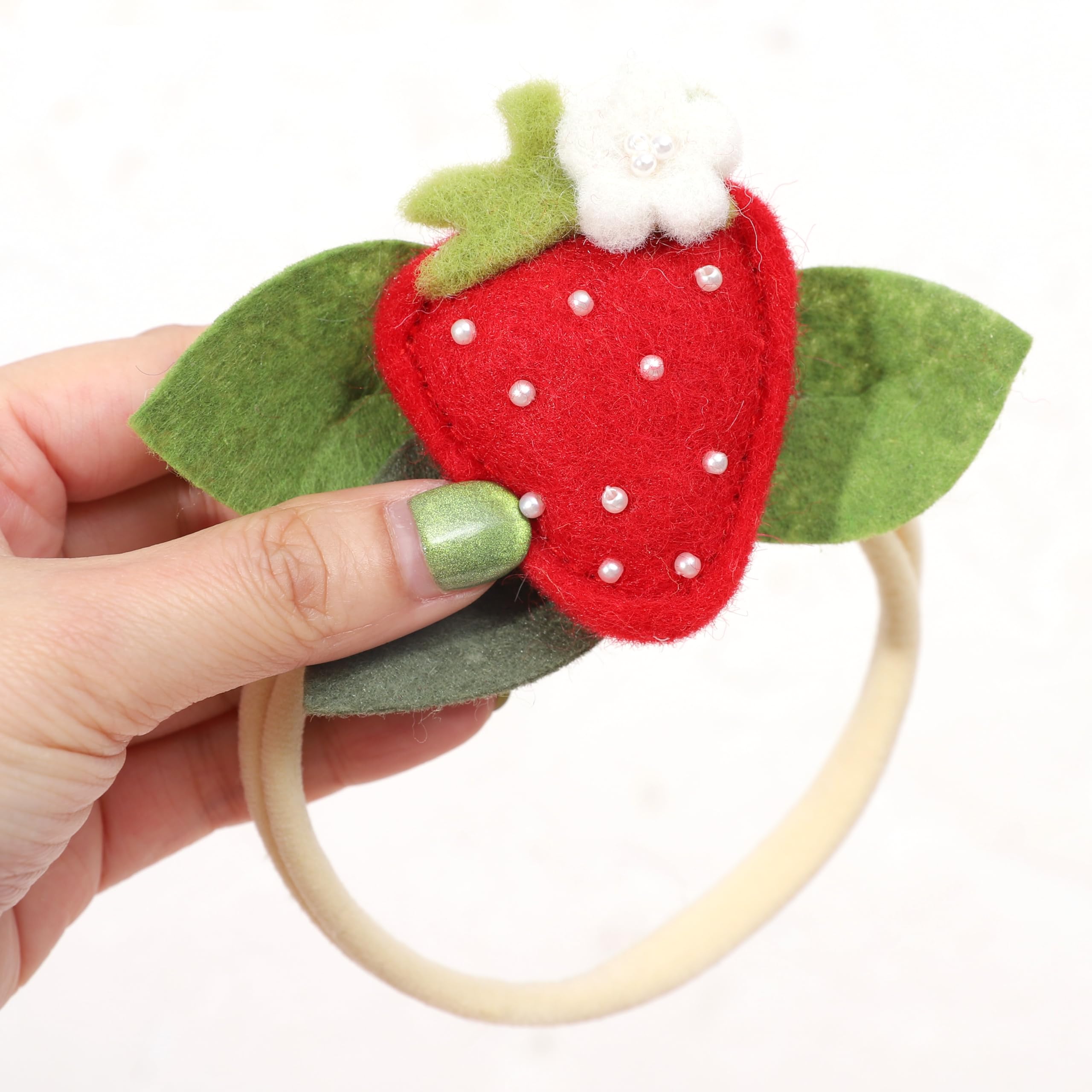 BASCT Strawberry Headband berry-sweet design features plush felt strawberry embellishment.