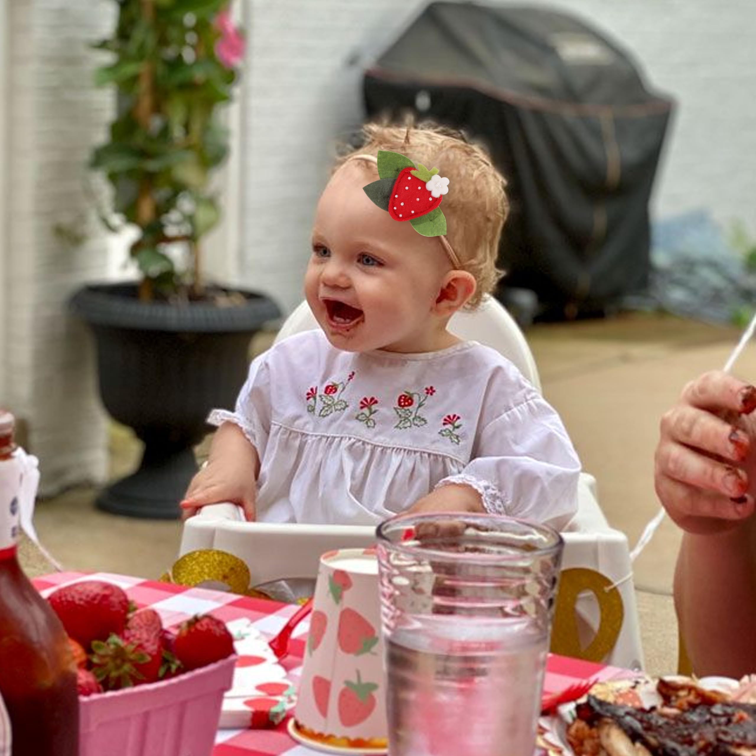 BASCT Strawberry Headband on-baby-girl during photoshoot captures cheerful charm.