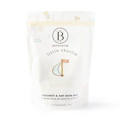 Bathorium Little Charlie Bath Soak bottle pour showing nourishing ingredients for delicate baby skin