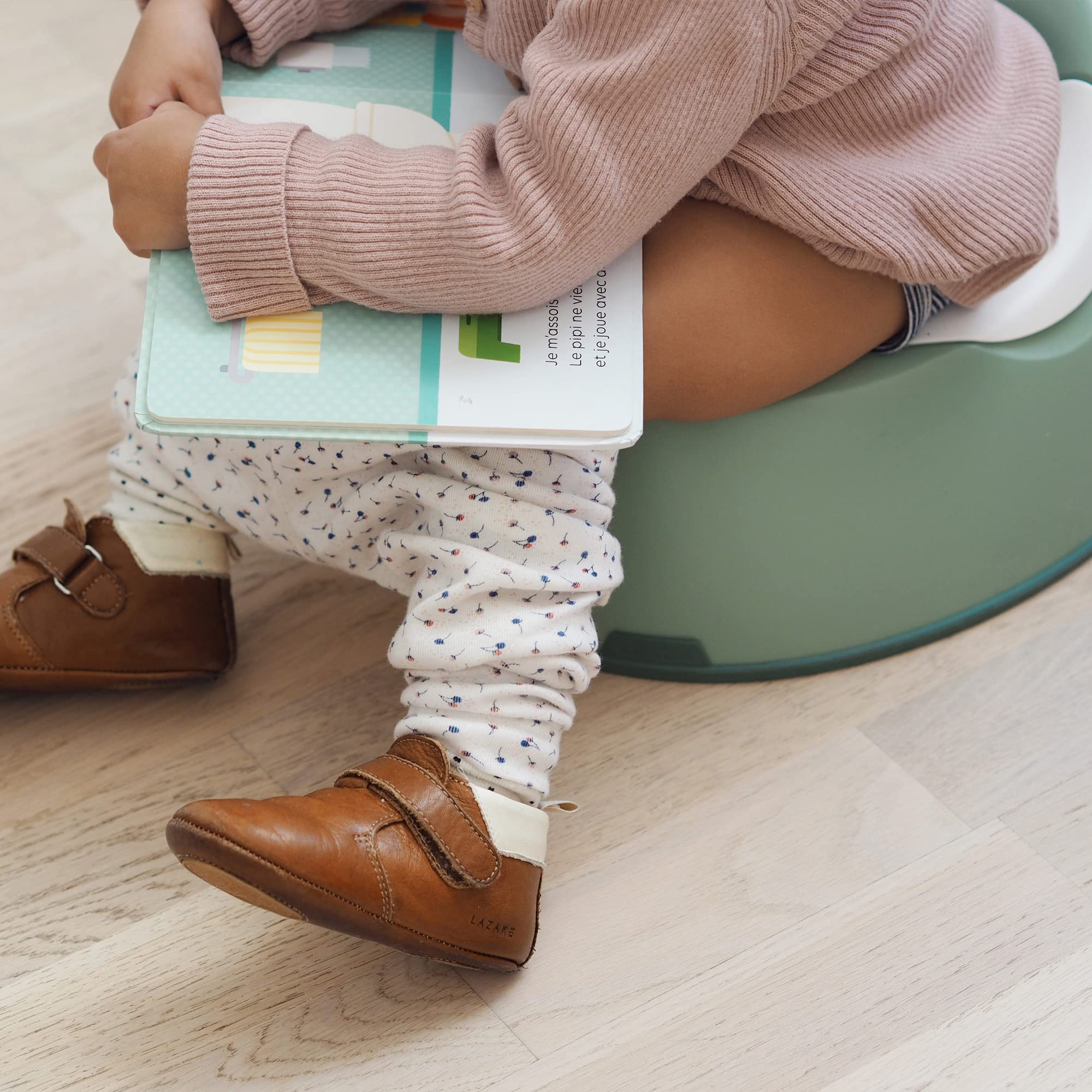 Beaba compact toddler potty sage top-view illustrates space-saving design for small bathrooms.