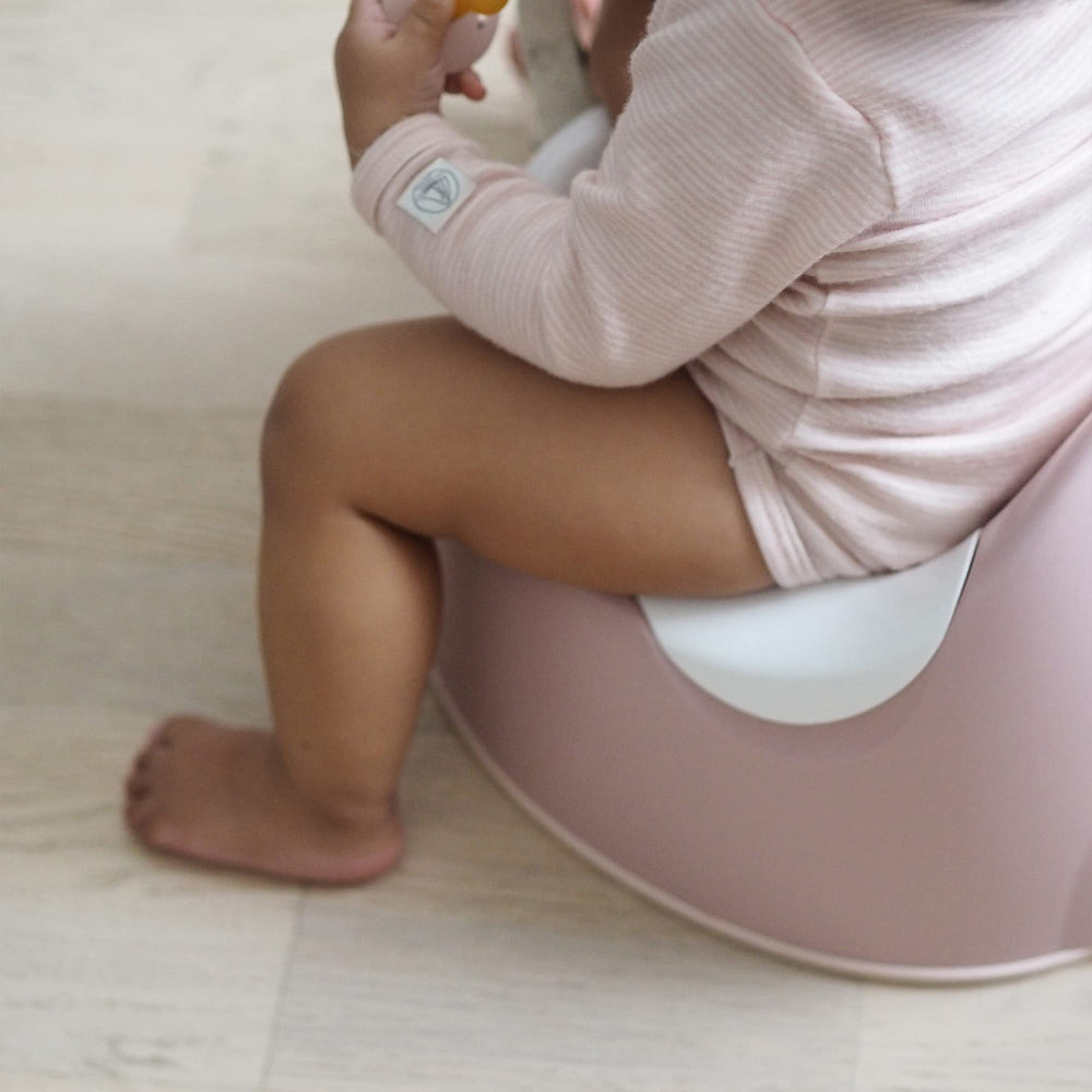 BEABA Ergonomic Training Potty rose portable handle aids on-the-go transitions.
