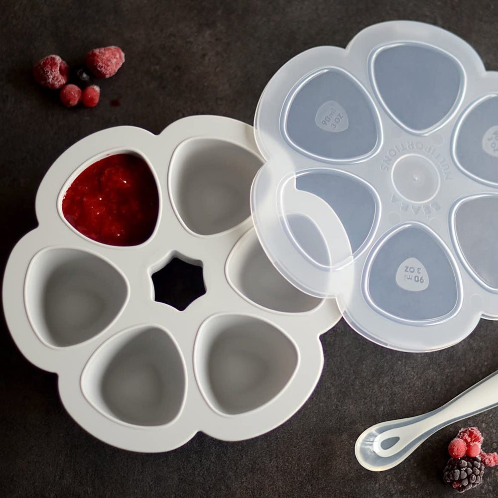 BEABA Multiportions clip-on lid seals portions for on-the-go feeding.