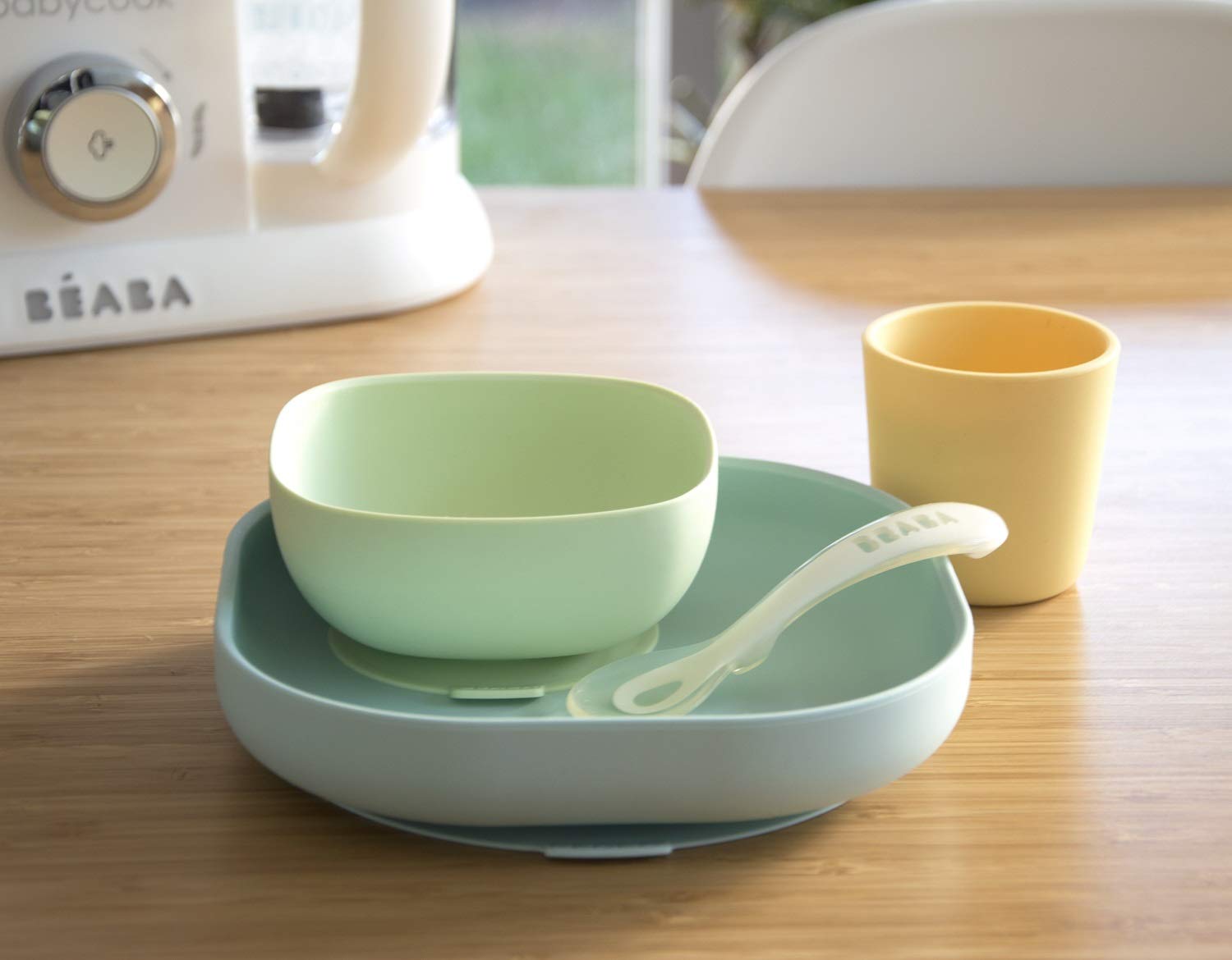 BEABA silicone cup pastel with soft grip for spill-free sips.