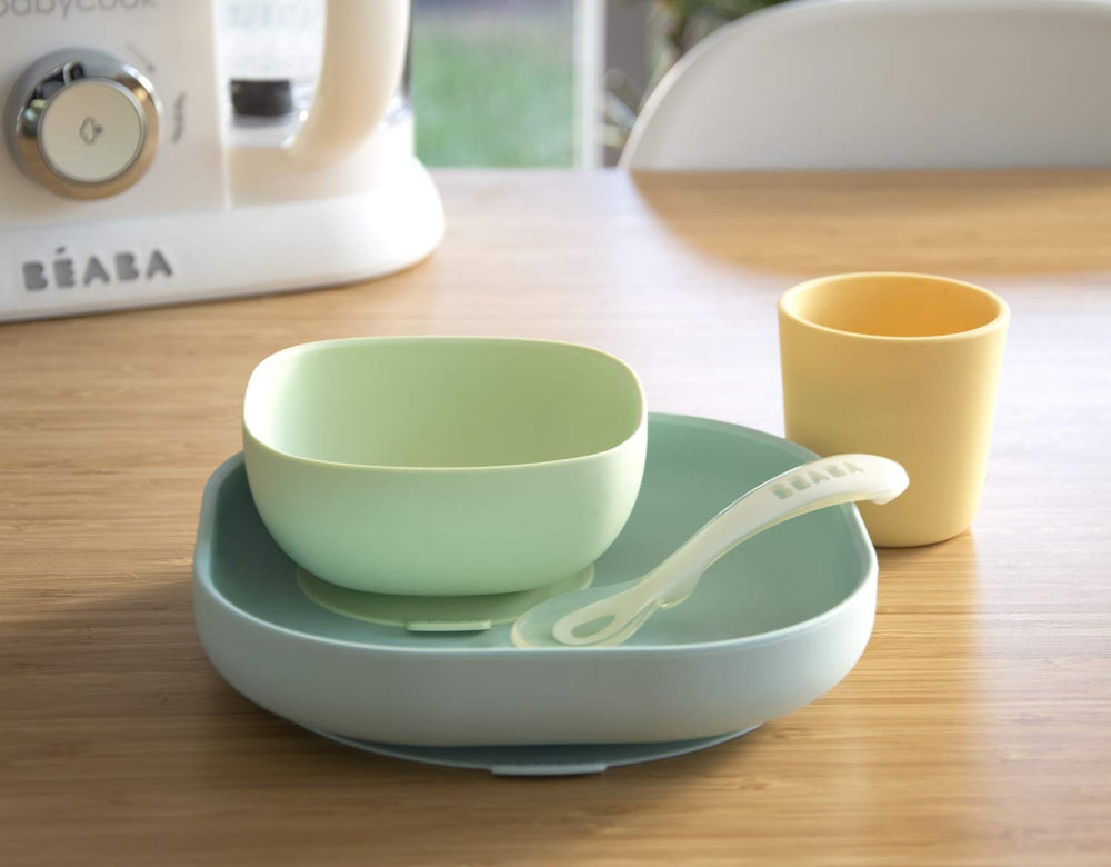 BEABA silicone cup pastel with soft grip for spill-free sips.