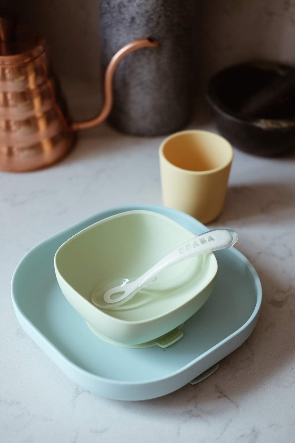 BEABA silicone spoon pastel with rounded tip for gentle on gums self-feeding.