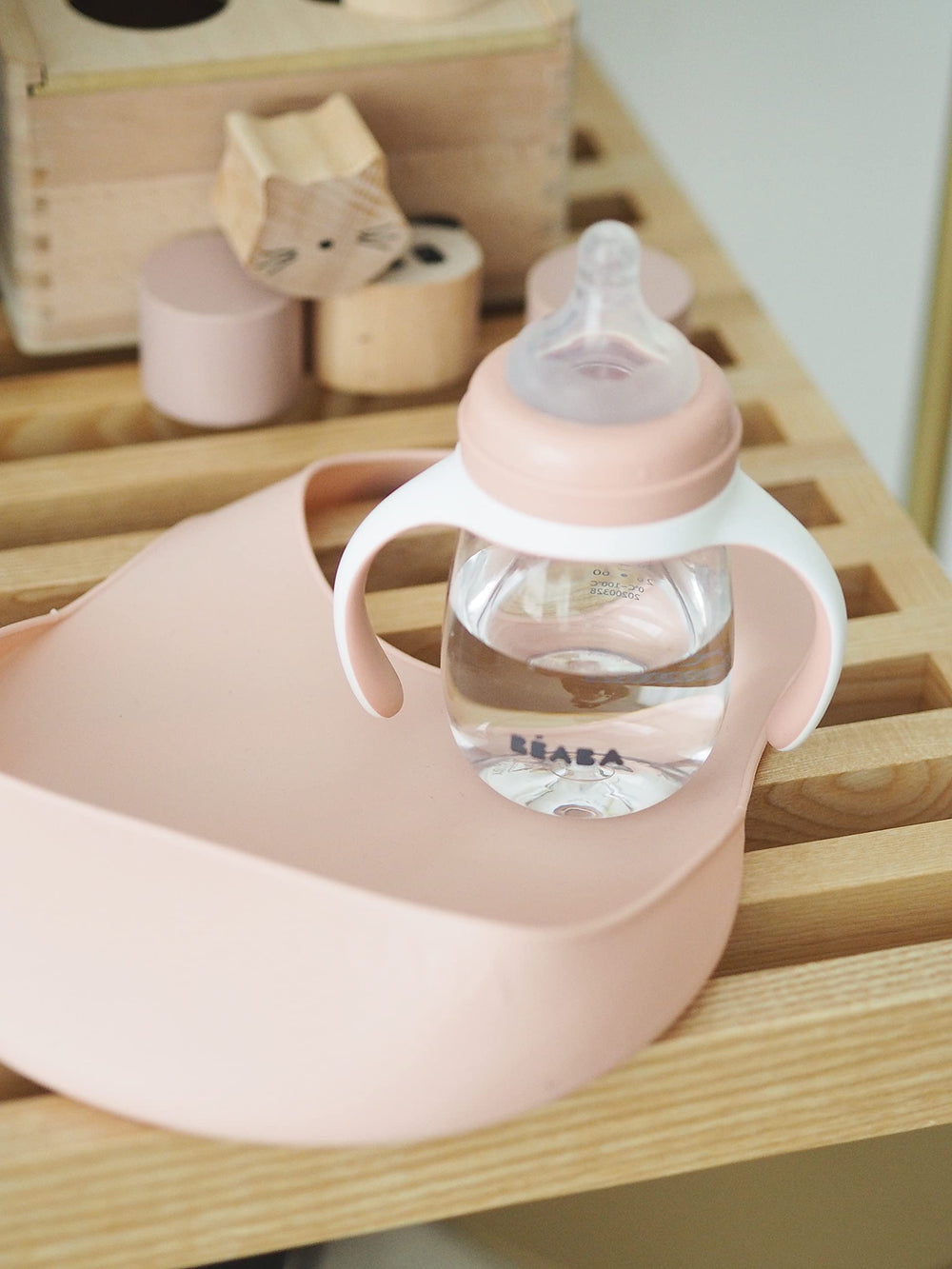Beaba silicone bib is wipe-clean and dishwasher-safe, simplifying post-meal cleanup.