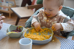 Beaba silicone baby cup Rain with easy-grip handle for small hands.