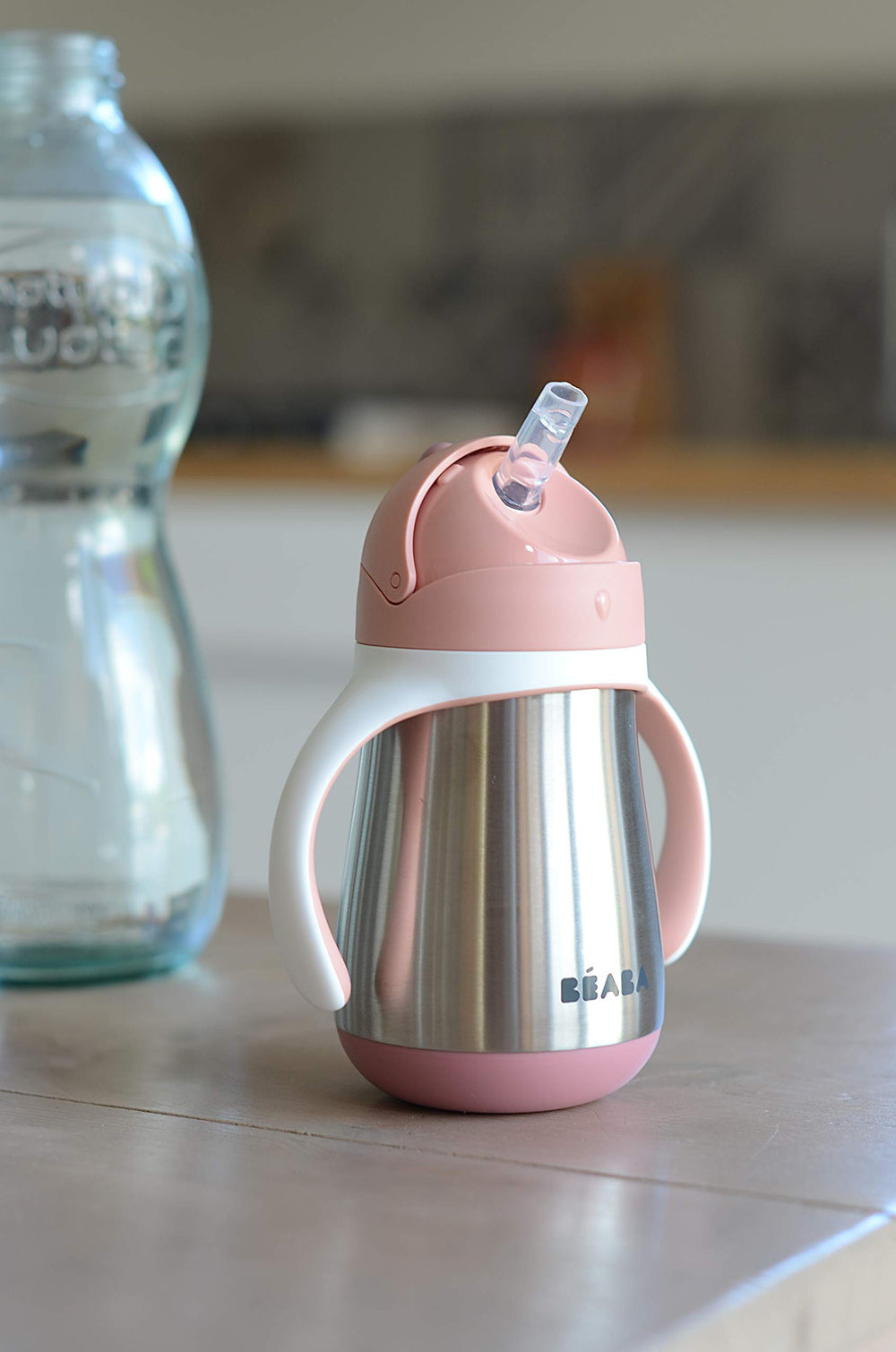 BEABA stainless steel cup with liquid inside demonstrates temperature retention for milk or water