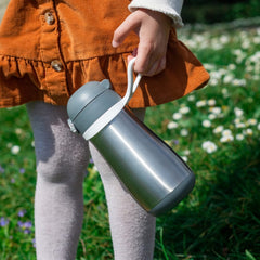 BEABA travel-friendly bottle with charcoal lid ideal for trips.