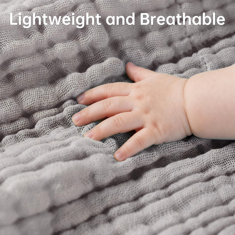 Bear Rocket organic muslin washcloth pink edge highlights cozy daily cleansing around tiny eyes and mouth.