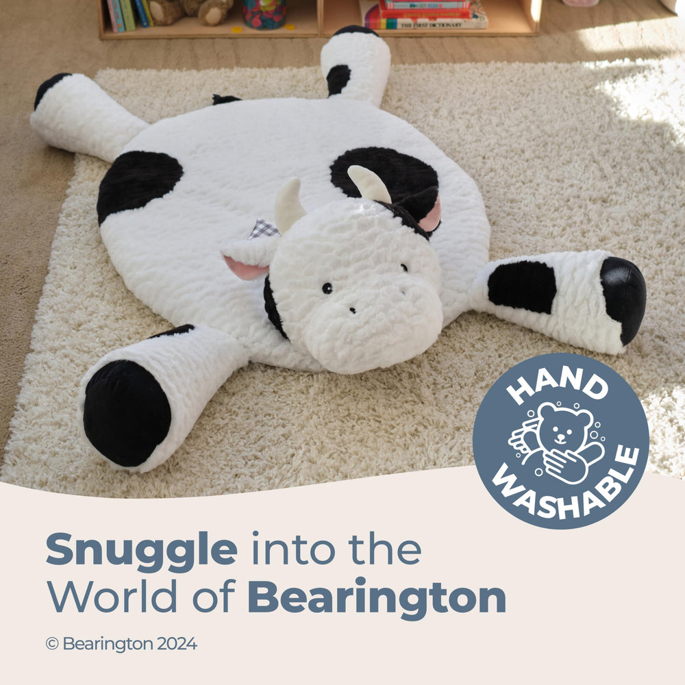 Bearington Collection nursery cow decor complements playtime setup in a nursery.