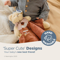 Bearington Collection Touchdown Snuggler teddy-holding design sparks curiosity during tummy time