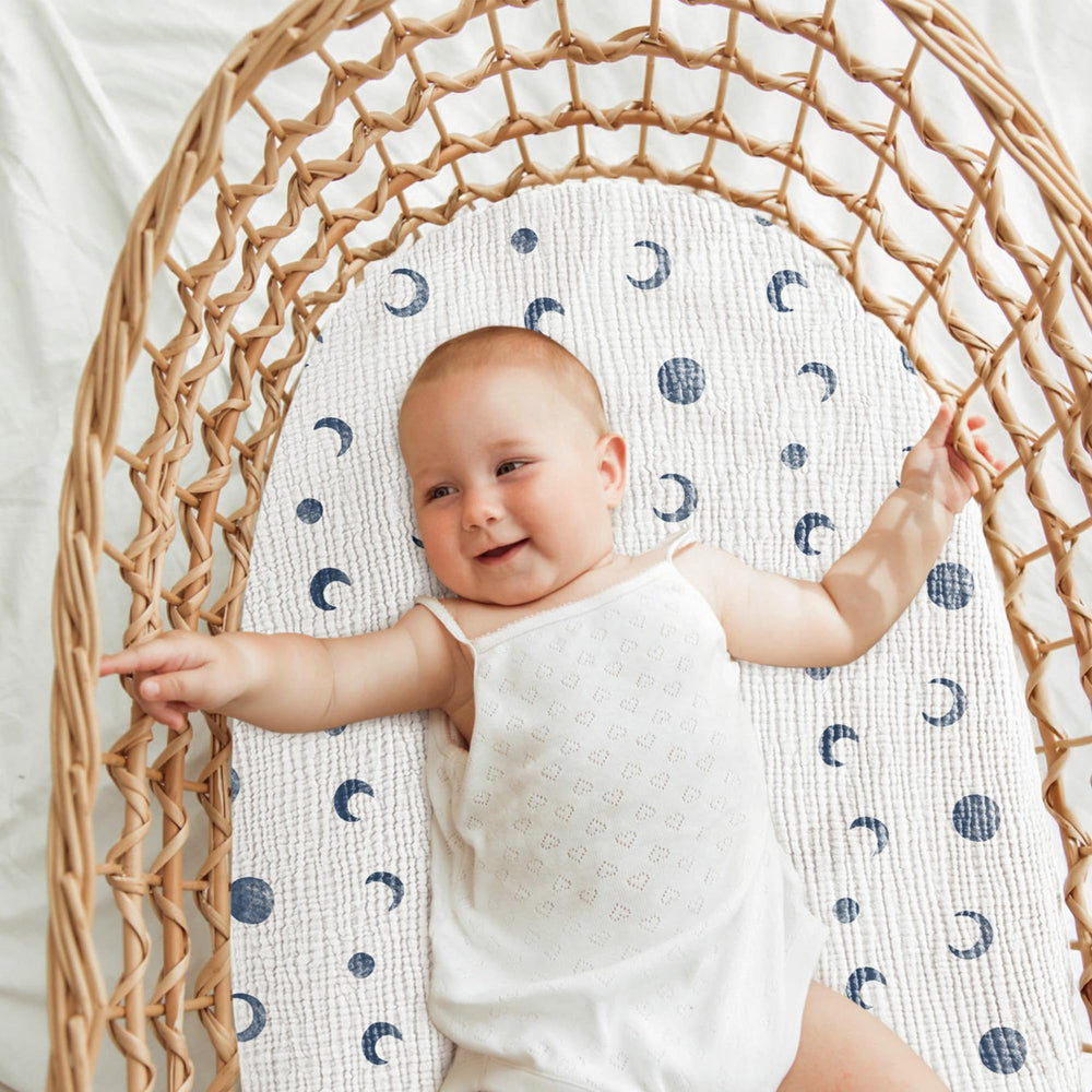 Bearmoss bassinet sheets feature an elastic edge for snug hold.