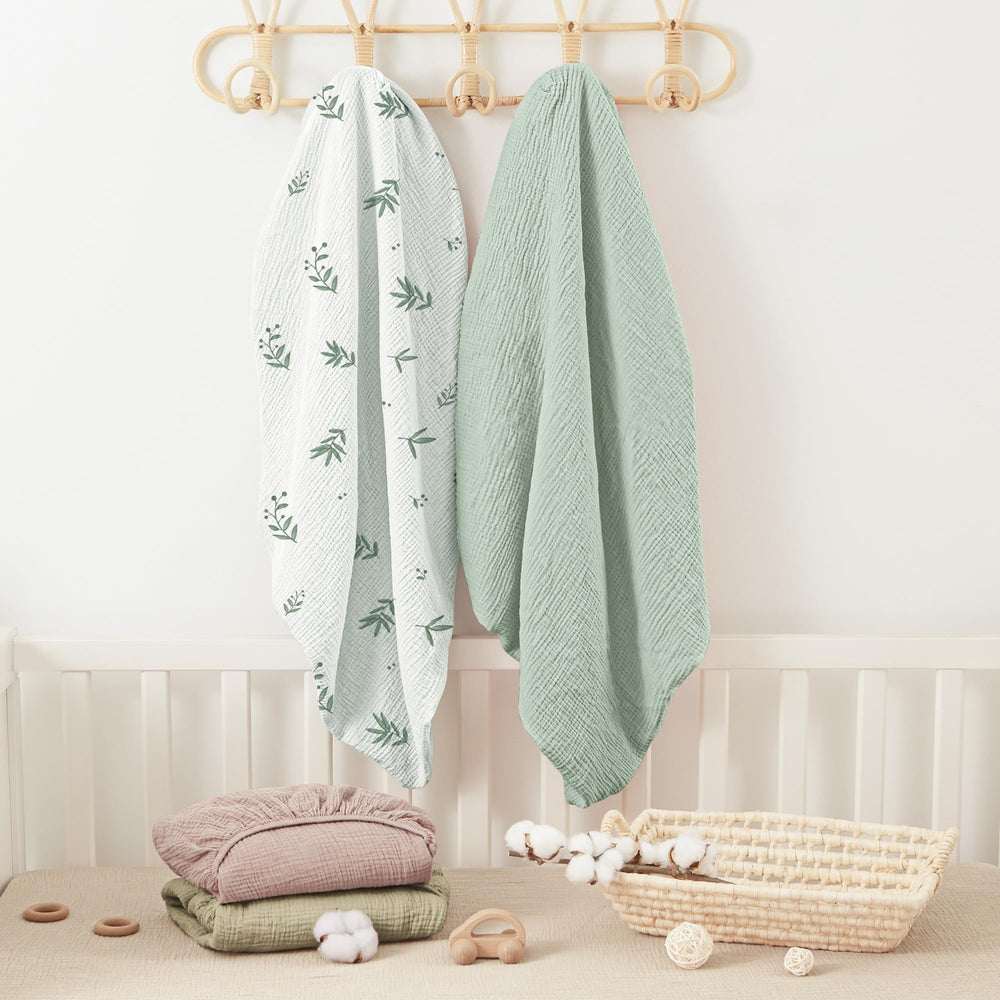 Bearmoss muslin crib sheets softening with each wash detail.