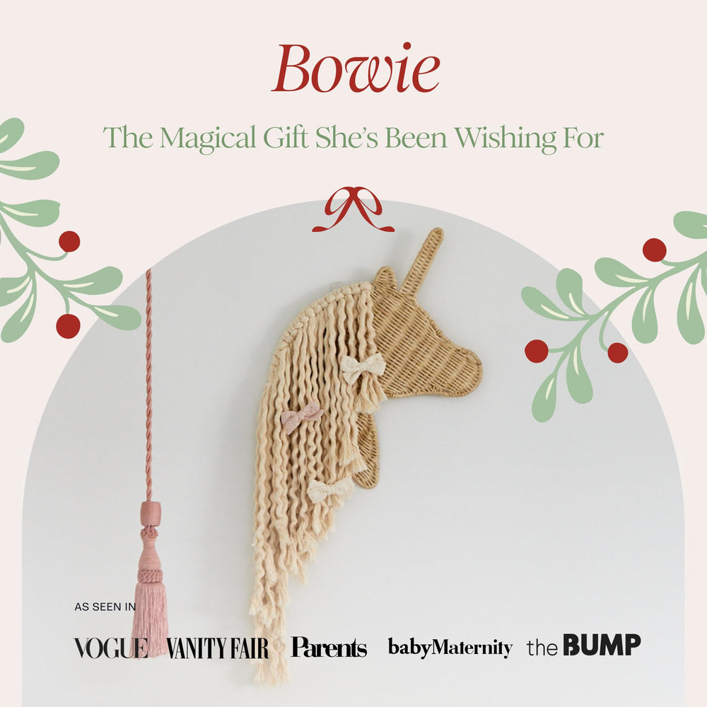 BEBE BASK unicorn rattan details add warm natural texture to a girl's room.