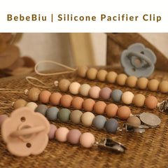 BebeBiu pacifier clip on baby clothes demonstrates easy access during outings