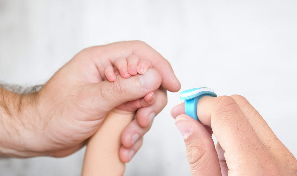 bebon parents using nail file on baby during a calm routine.