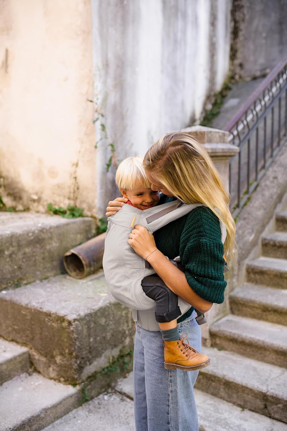 Beco carrier with detachable hood in ecru offers shade or nursing cover.