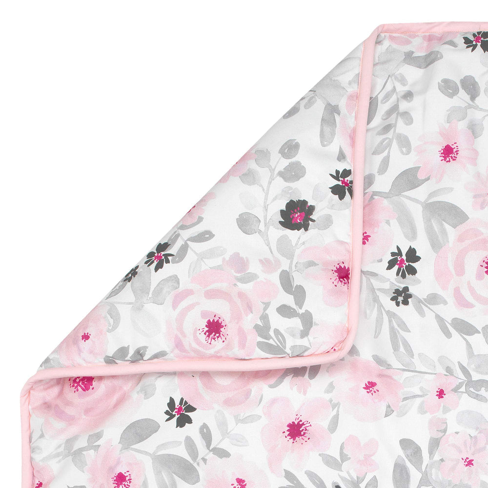 Bedtime Originals Blossom Pink Watercolor Crib Sheet close-up shows microfiber texture