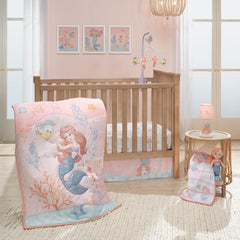 Bedtime Originals Disney Baby Little Mermaid quilt close-up showing soft watercolor design for tummy time