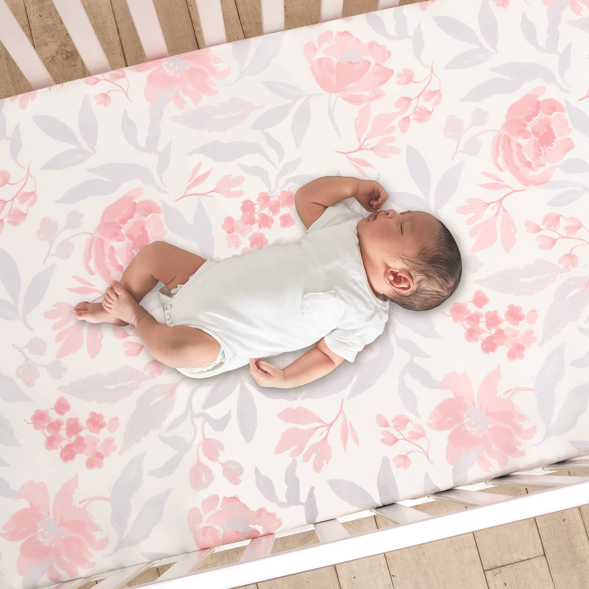 Bedtime Originals Lavender Floral quilt on crib demonstrates soft pastel colors