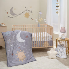 Bedtime Originals Little Star quilt with crescent moon applique for cozy nursery décor.
