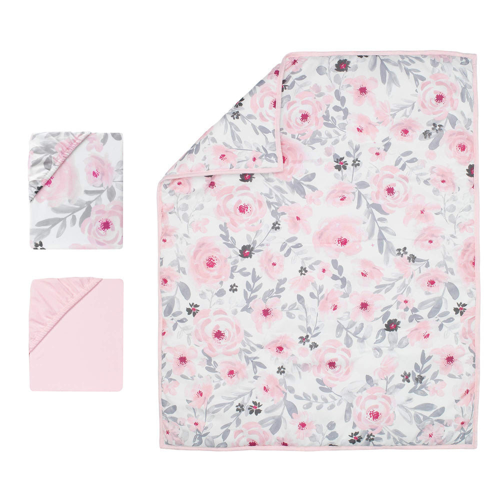 Bedtime Originals Mini Crib Bedding Set on display emphasizes a compact fit and cohesive color.