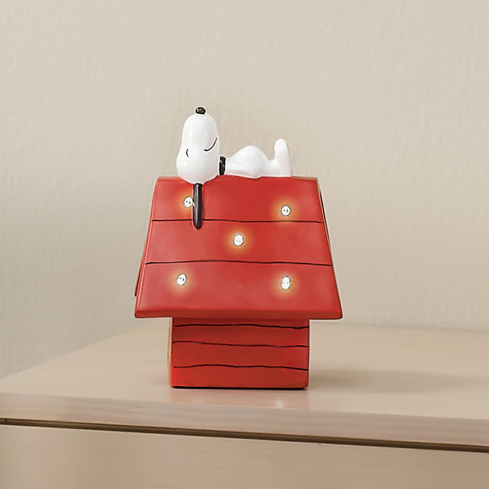 Bedtime Originals red-roof dog house night light provides bright accent.