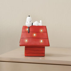 Bedtime Originals red-roof dog house night light provides bright accent.