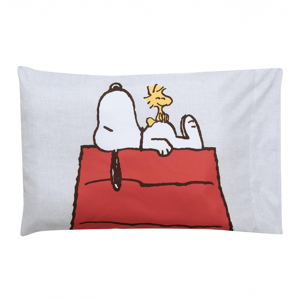 Bedtime Originals Snoopy Love pillowcase shows Snoopy on the red roof dog house.