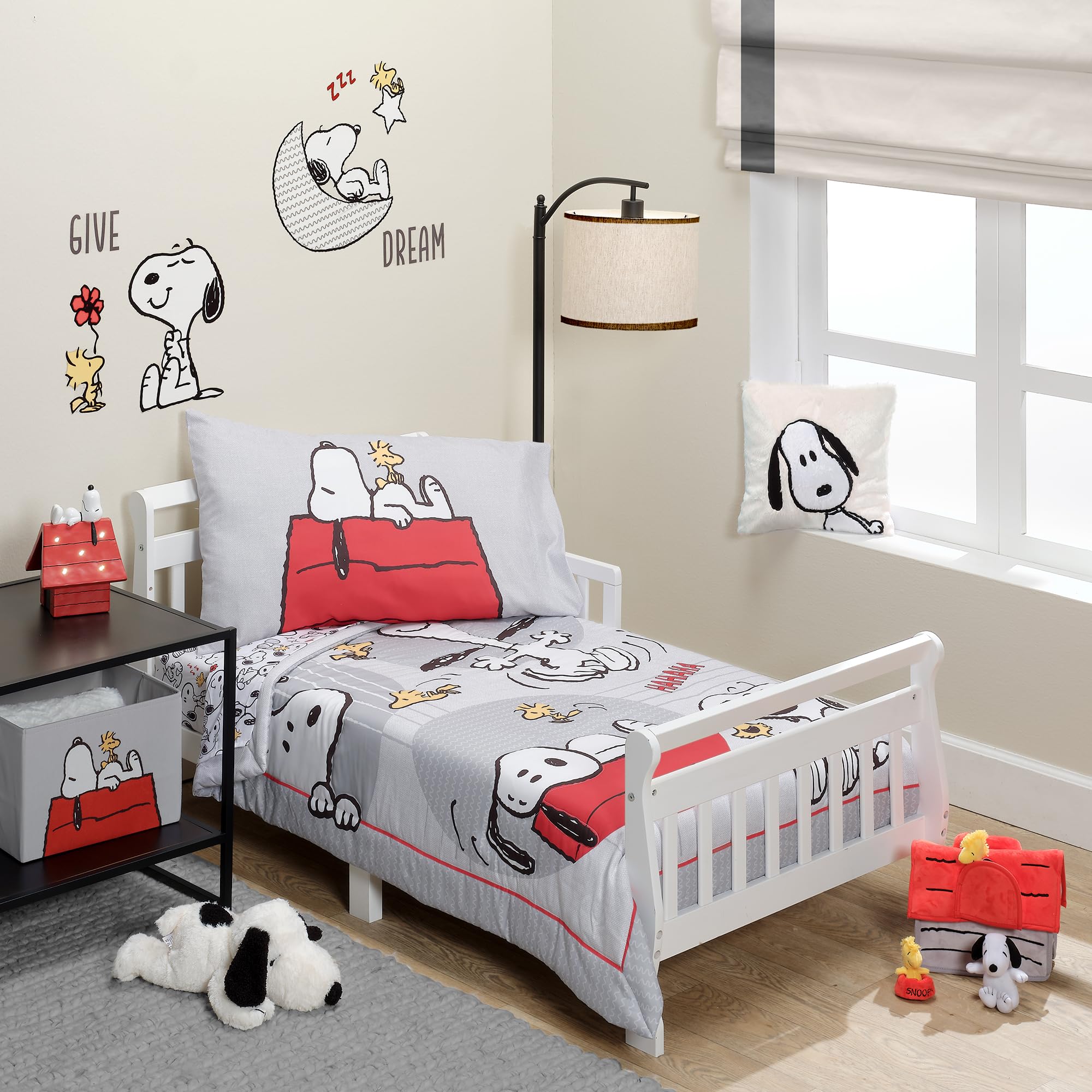 Bedtime Originals Snoopy Love quilt close-up with Woodstock for cozy bedtime snuggles.