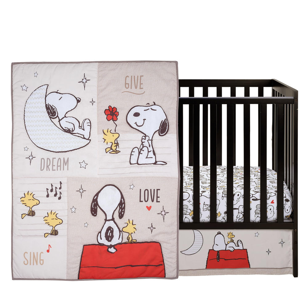 Bedtime Originals Snoopy Love quilt design features Snoopy and stars in cozy print.